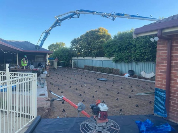A prepared pool-side area with bar chairs laid out ready for the pour