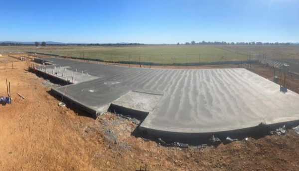 A large rural slab poured beside open paddocks